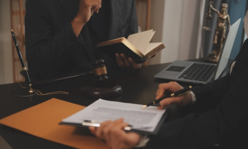 Criminal defense attorney reviewing legal documents